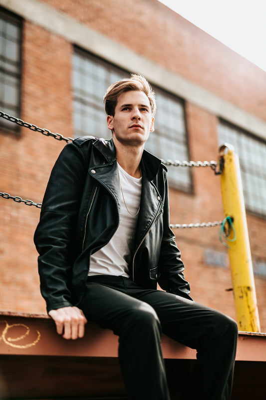 Person wearing a well-fitted leather jacket