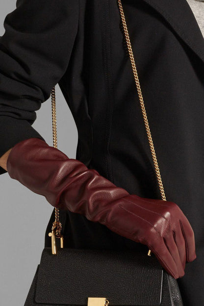 Burgundy leather opera gloves with black handbag gold chain